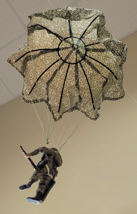 Paratrooper with Hanging Plant Basket Frame in Parachute (Cropped, Reduced, Converted).png